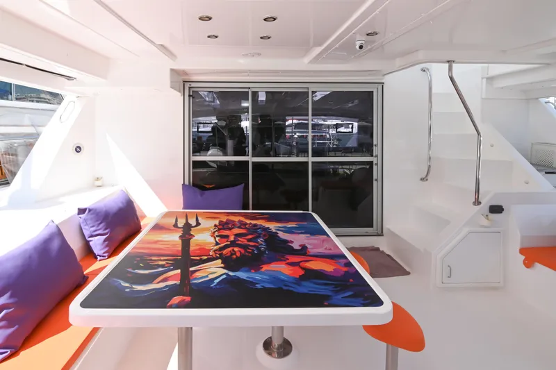  Yacht Photos Pics 2017 Leopard 51 Powercat interior with vibrant table art and colorful seating.