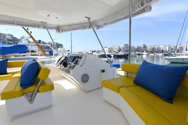  Yacht Photos Pics Luxurious 2017 Leopard 51 Powercat yacht interior with yellow seating and blue cushions.