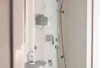 2017 Leopard 51 Powercat bathroom with modern shower and sleek fixtures.