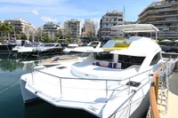 2017 Leopard 51 Powercat yacht docked in a marina with cityscape background.
