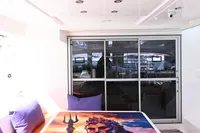 2017 Leopard 51 Powercat interior with vibrant artwork on table, purple cushions, and modern design.
