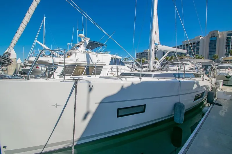  Yacht Photos Pics 2021 Bavaria C45 yacht docked at marina under clear blue sky.