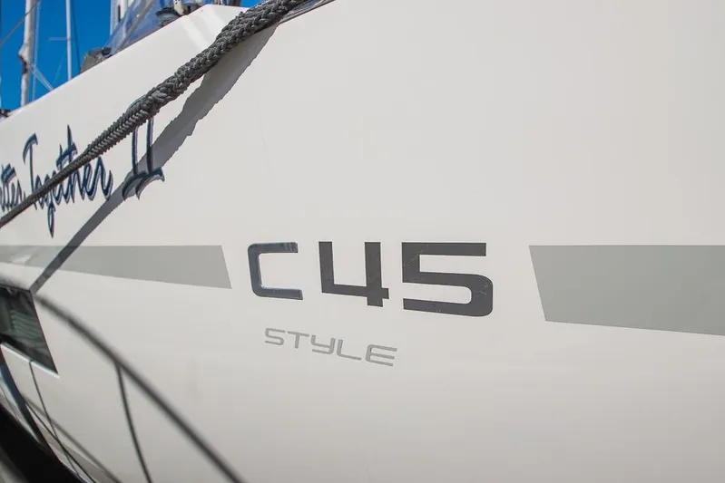  Yacht Photos Pics 2021 Bavaria C45 sailboat side view with "Style" branding.