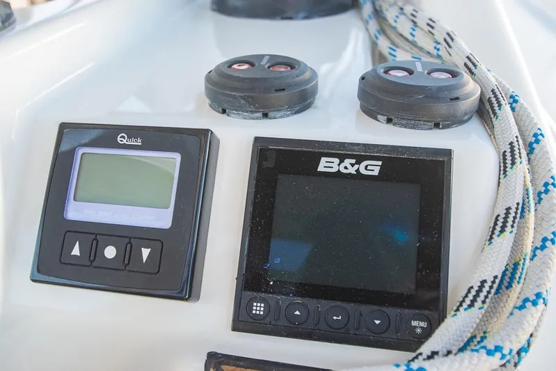  Yacht Photos Pics Bavaria C45 2021 yacht control panel with navigation instruments and ropes.