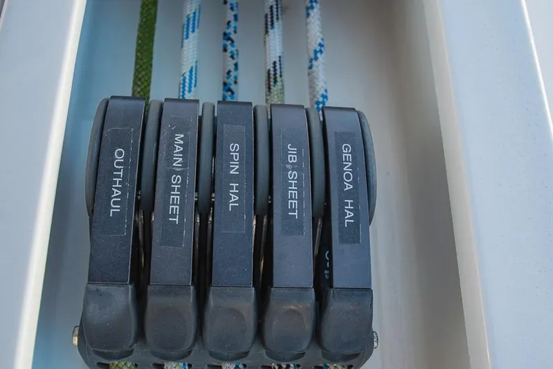  Yacht Photos Pics Sailing controls on a 2021 Bavaria C45 yacht, featuring labeled rope clutches.