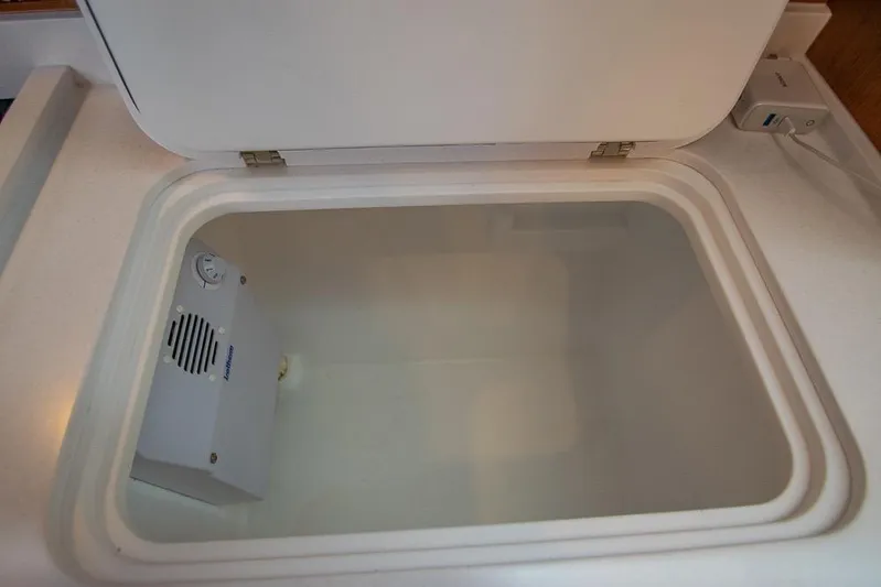  Yacht Photos Pics Open storage compartment in 2021 Bavaria C45 yacht interior.