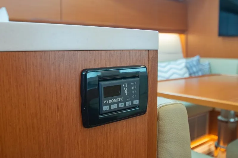  Yacht Photos Pics Interior of 2021 Bavaria C45 yacht with Dometic control panel and cozy seating area.
