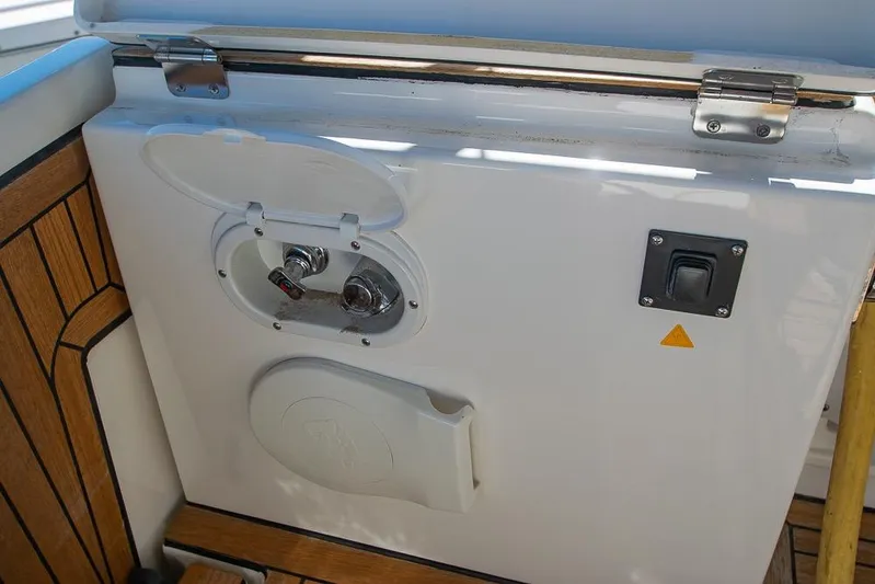  Yacht Photos Pics Bavaria C45 2021 yacht deck with control panel and wooden flooring.