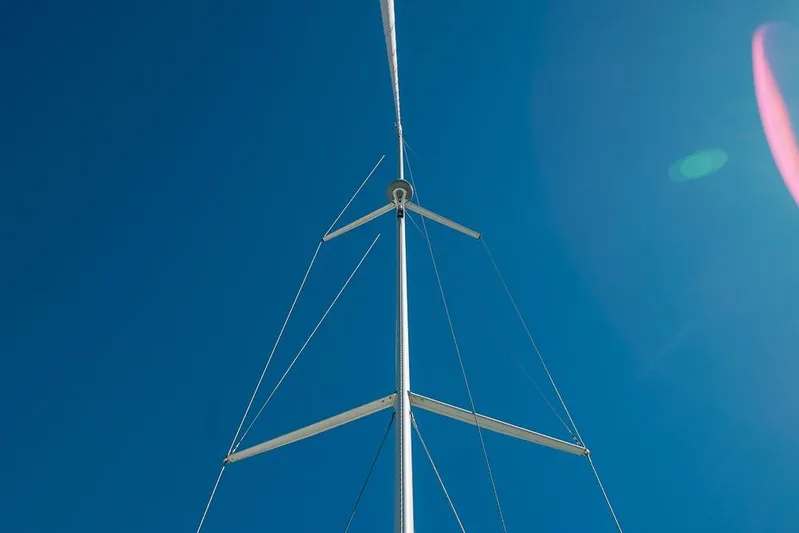  Yacht Photos Pics Sailboat mast of 2021 Bavaria C45 against clear blue sky.