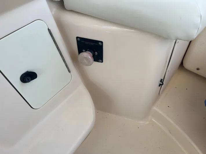  Yacht Photos Pics 2006 Grady-White Express 360 boat interior detail with control panel and storage compartment.