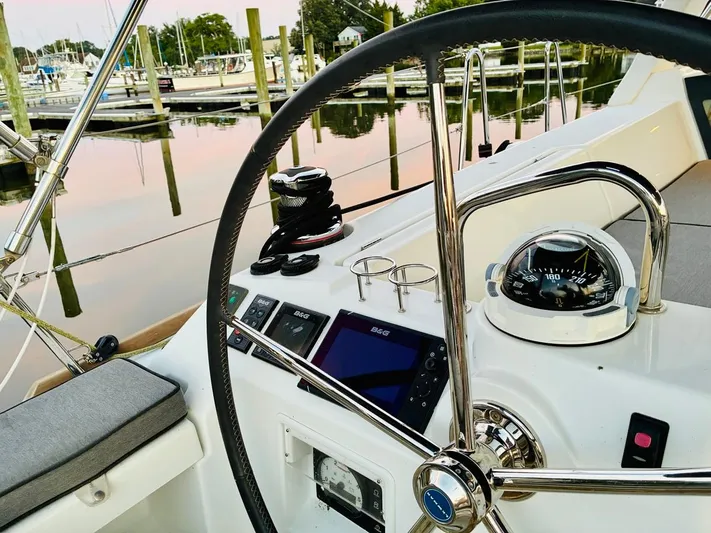  Yacht Photos Pics Steering wheel and navigation instruments on a 2017 Beneteau Oceanis 45 sailboat.