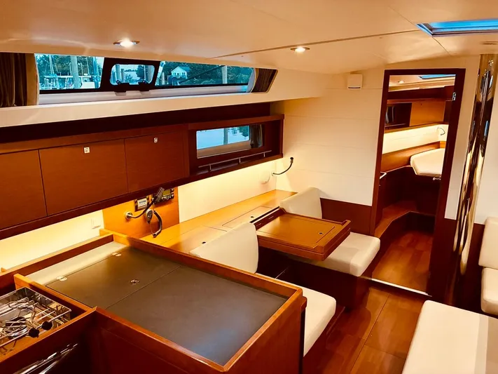  Yacht Photos Pics Interior of 2017 Beneteau Oceanis 45 yacht, featuring elegant wood finishes and modern design.
