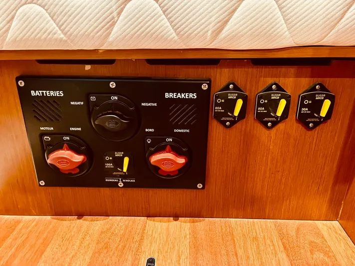  Yacht Photos Pics Electrical panel on a 2017 Beneteau Oceanis 45 yacht, featuring battery and breaker controls.