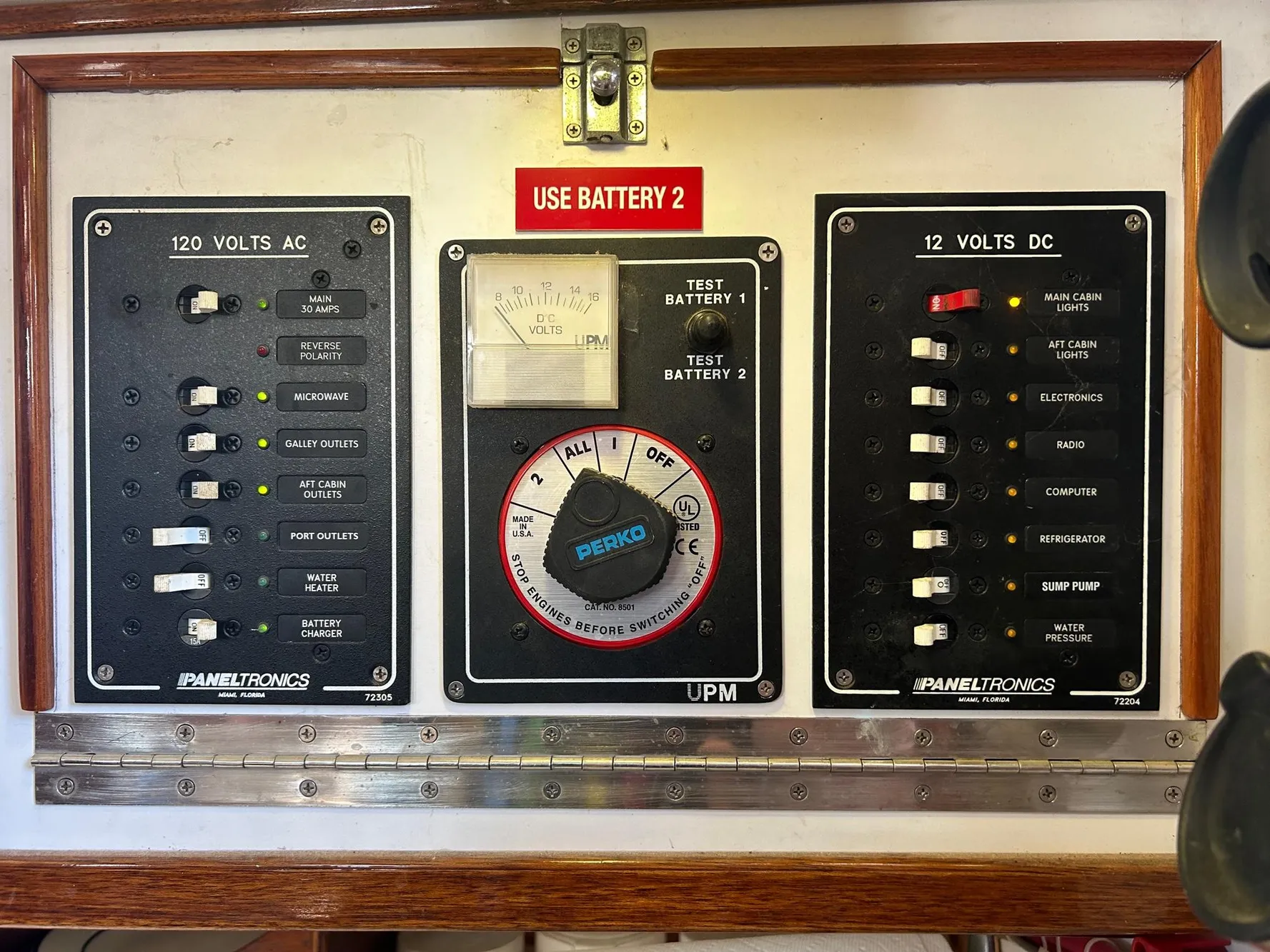Electrical control panel on a 1975 Salar 40 boat, featuring AC and DC switches.