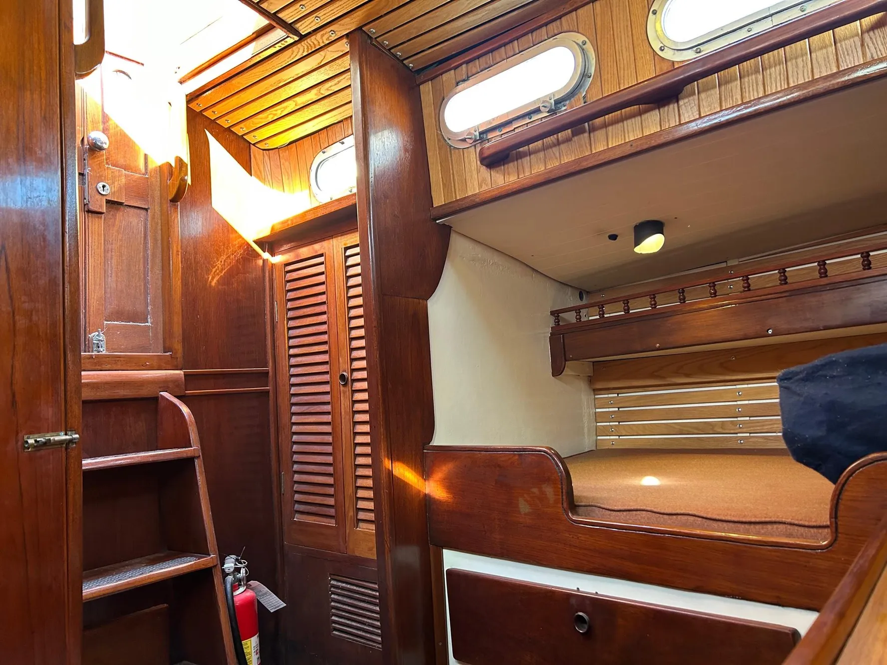 Interior of a 1975 Salar 40 sailboat with wooden furnishings and cozy cabin space.