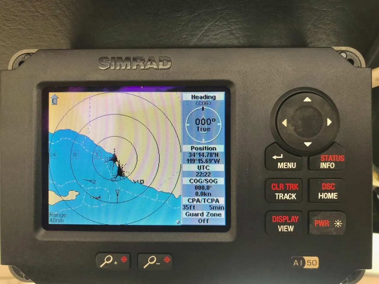 Simrad marine GPS display showing navigation data and map, on a 1975 Salar 40 boat.
