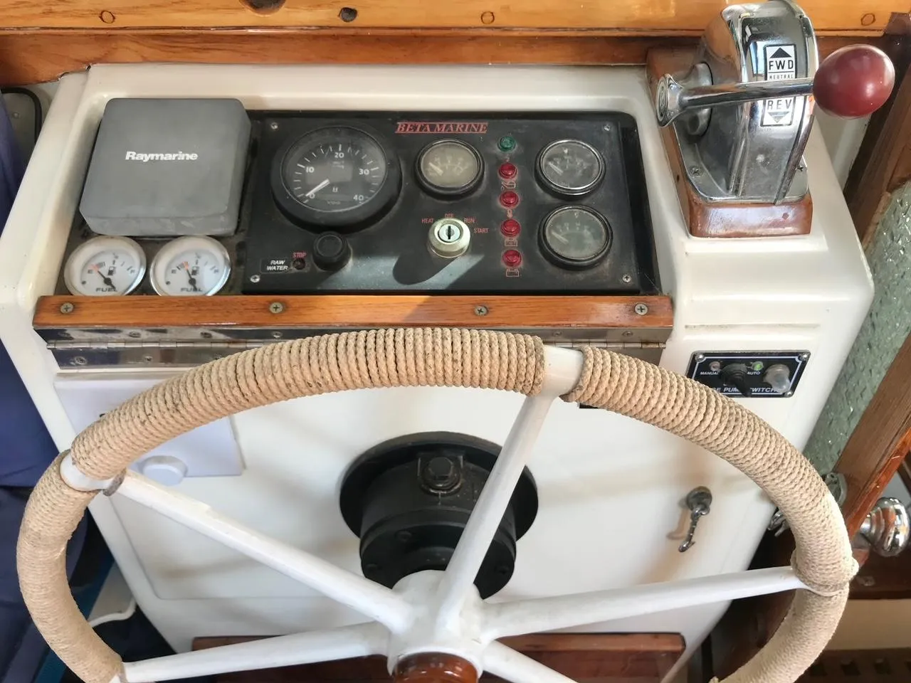 Vintage 1975 Salar 40 boat helm with steering wheel and control panel.