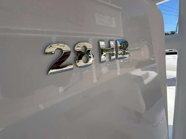 Black Label Marine Yacht Photos Pics Close-up of Caymas 28 HB 2026 boat emblem.