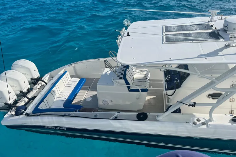 N/a Yacht Photos Pics 2014 Midnight Express 37 EXK boat on clear blue water, featuring sleek design and powerful engines.