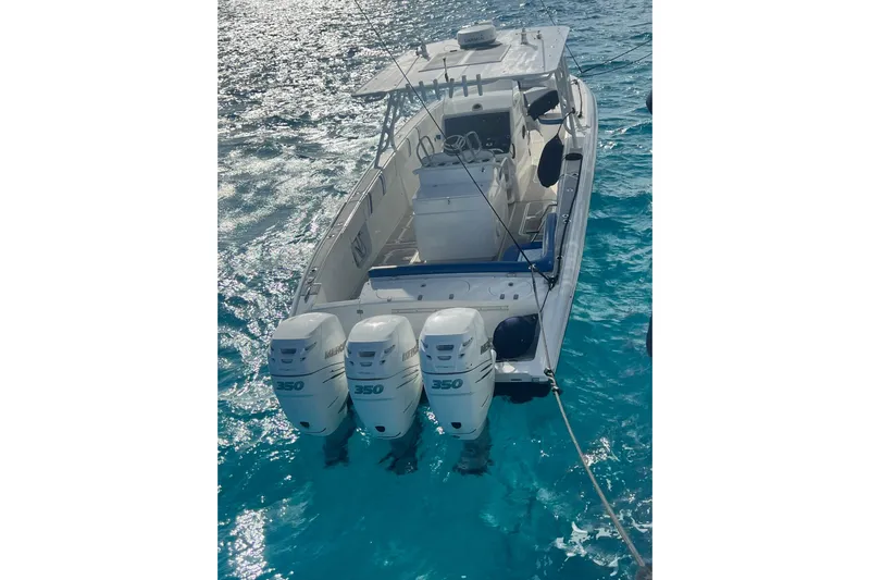 N/a Yacht Photos Pics 2014 Midnight Express 37 EXK boat with triple 350 engines on clear blue water.