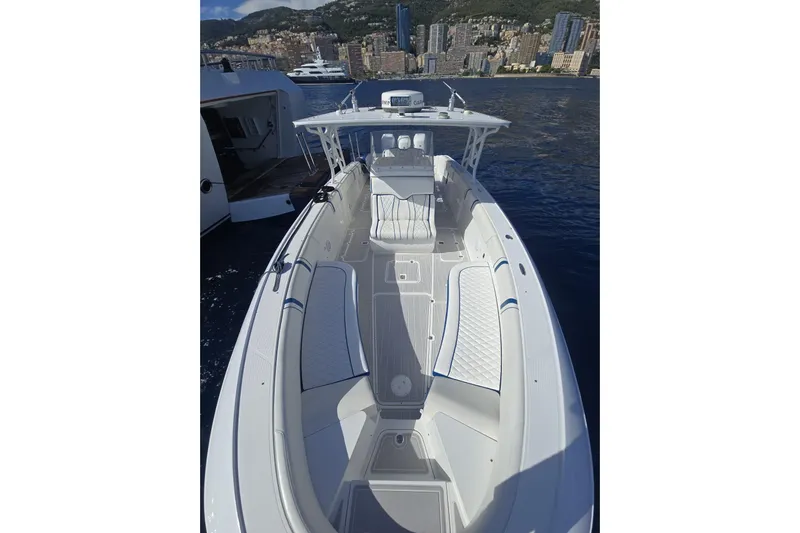 N/a Yacht Photos Pics 2014 Midnight Express 37 EXK boat with sleek design, docked near cityscape.