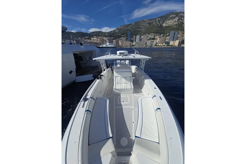 N/a Yacht Photos Pics 2014 Midnight Express 37 EXK boat on water with cityscape and mountains in background.