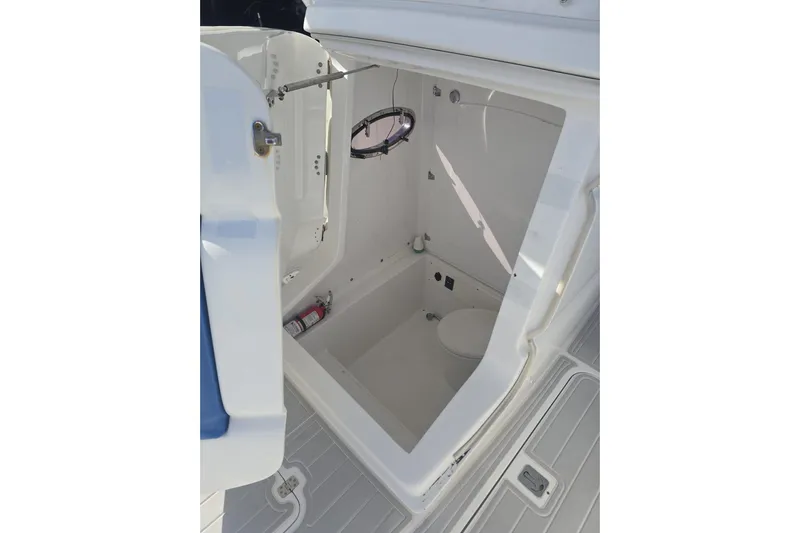 N/a Yacht Photos Pics Interior of 2014 Midnight Express 37 EXK boat, featuring a compact marine toilet.