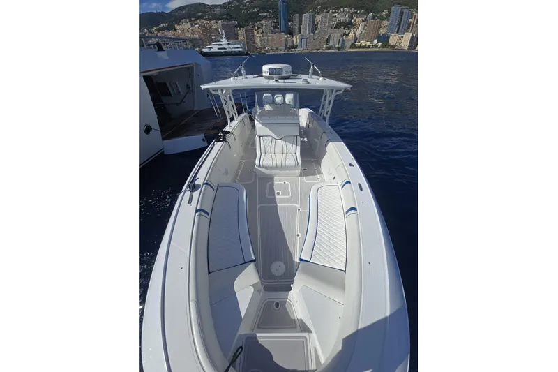 N/a Yacht Photos Pics 2014 Midnight Express 37 EXK boat on water, cityscape background.