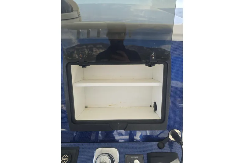 N/a Yacht Photos Pics Open storage compartment on 2014 Midnight Express 37 EXK boat dashboard.