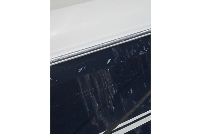 N/a Yacht Photos Pics Close-up of 2014 Midnight Express 37 EXK boat hull with visible wear.