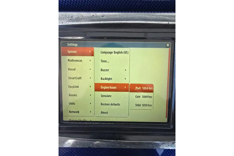 N/a Yacht Photos Pics Touchscreen display showing engine hours for a 2014 Midnight Express 37 EXK boat.
