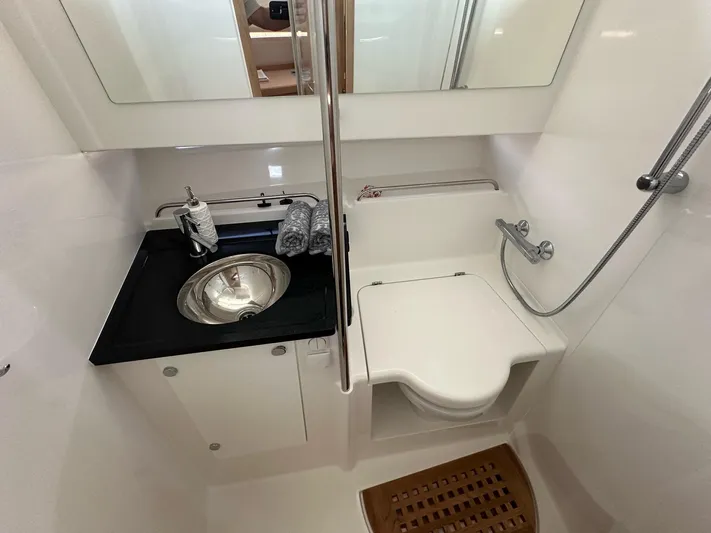 Mdr #187 In Stock Yacht Photos Pics Compact bathroom in 2023 Nimbus T11 boat with sink, toilet, and shower.