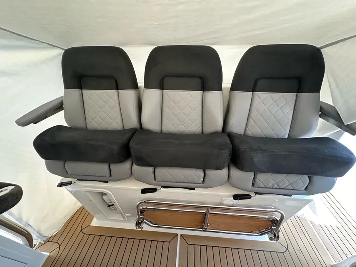 Mdr #187 In Stock Yacht Photos Pics Three luxurious seats on a 2023 Nimbus T11 boat, featuring elegant gray upholstery.