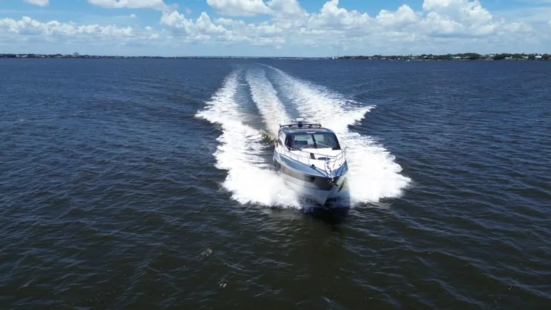  Yacht Photos Pics Luxury yacht Real 40 HT 2025 cruising on open water under blue skies.