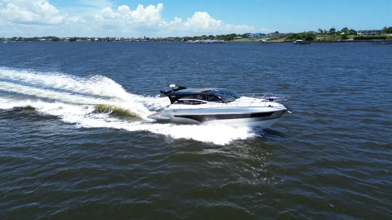  Yacht Photos Pics Luxury yacht Real 40 HT 2025 cruising on open water under clear skies.