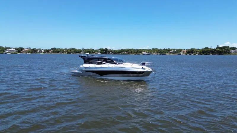  Yacht Photos Pics 2025 Real 40 HT Luxury yacht cruising on a sunny day.