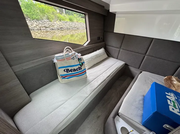  Yacht Photos Pics Interior of 2025 Real 40 HT Luxury yacht with beach bag and window view.