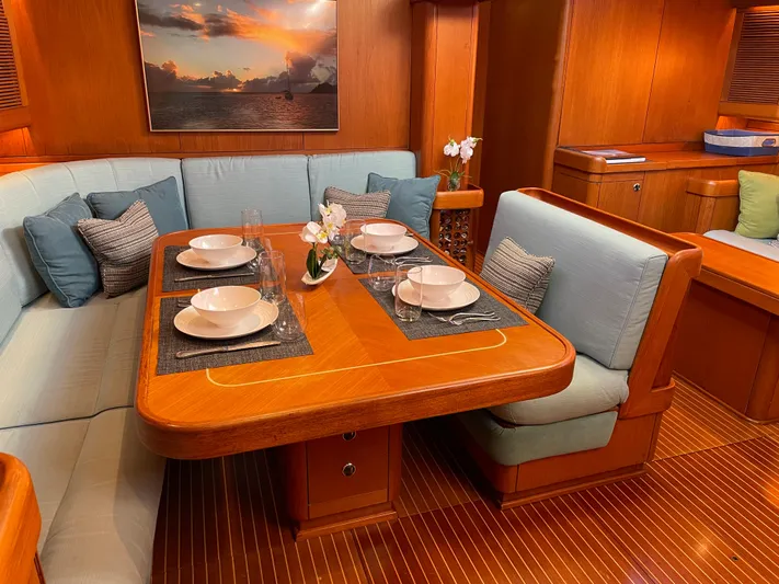 Disco Lemonade Yacht Photos Pics Luxurious dining area in a 1992 Nautor Swan 68 yacht with elegant table setting.