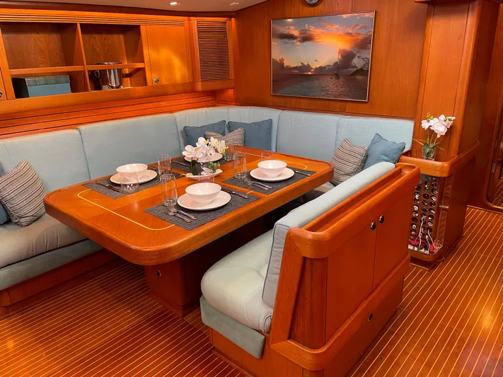 Disco Lemonade Yacht Photos Pics Luxurious dining area on a 1992 Nautor Swan 68 yacht with elegant wood finish.