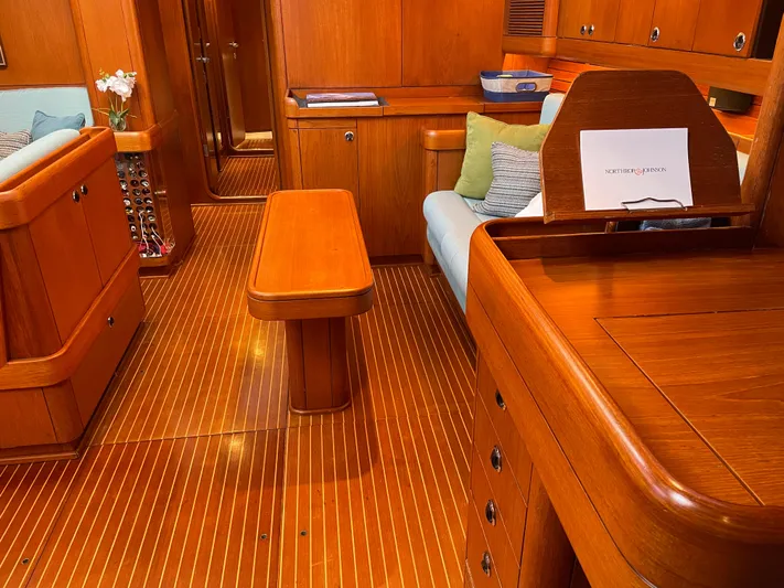 Disco Lemonade Yacht Photos Pics Interior of 1992 Nautor Swan 68 yacht with wooden furnishings and cozy seating.