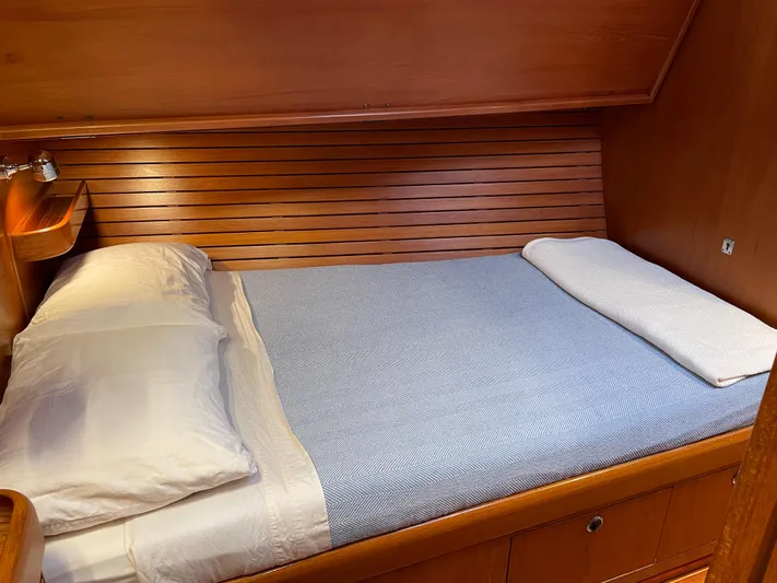 Disco Lemonade Yacht Photos Pics Cozy cabin bed in 1992 Nautor Swan 68 yacht with wooden paneling.