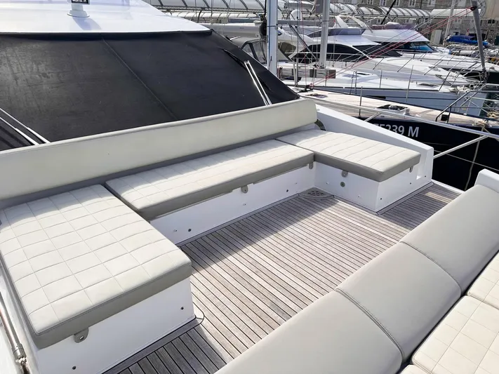 Tamara II Yacht Photos Pics Luxurious seating area on 2018 Azimut 66 FLY yacht, featuring sleek design and comfortable cushions.
