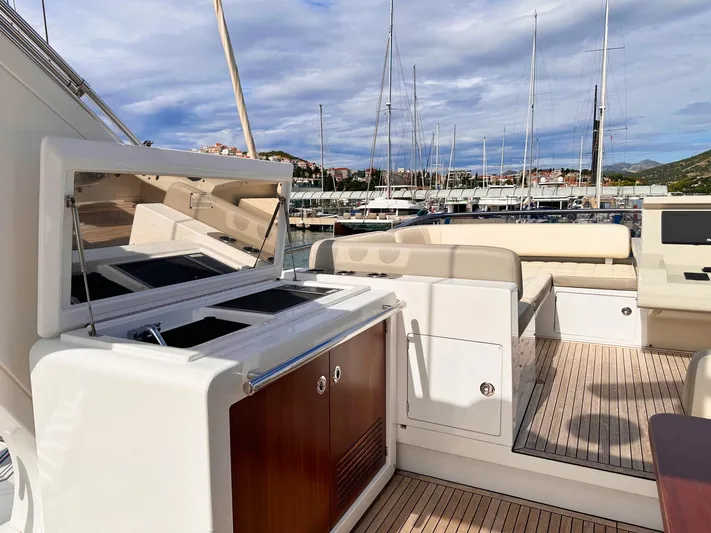 Tamara II Yacht Photos Pics Luxurious 2018 Azimut 66 FLY yacht with elegant deck and marina view.
