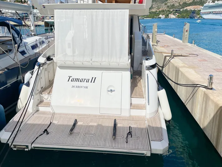 Tamara II Yacht Photos Pics 2018 Azimut 66 FLY yacht docked, rear view with "Tamara II" name visible.