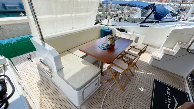 Tamara II Yacht Photos Pics 2018 Azimut 66 FLY yacht deck with seating, table, and nautical decor.
