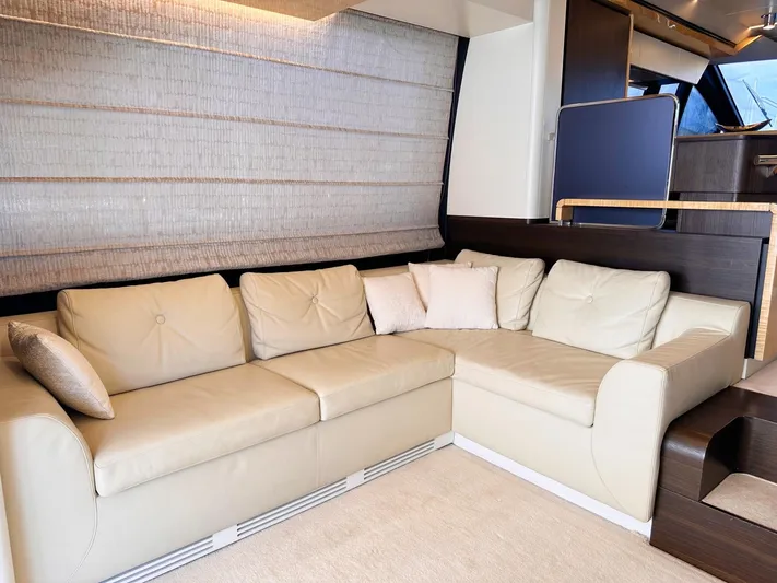 Tamara II Yacht Photos Pics Luxurious interior of 2018 Azimut 66 FLY yacht with beige leather sofa and modern design.