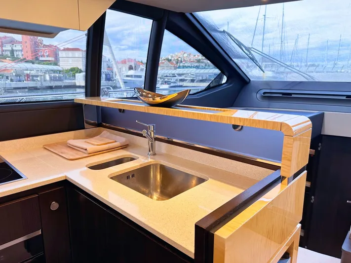 Tamara II Yacht Photos Pics Luxurious interior of 2018 Azimut 66 FLY yacht featuring modern kitchen design.