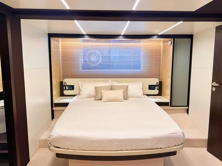Tamara II Yacht Photos Pics Luxurious bedroom interior of 2018 Azimut 66 FLY yacht with modern design and cozy ambiance.
