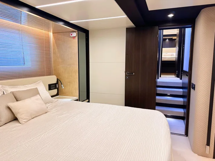 Tamara II Yacht Photos Pics Luxurious bedroom interior of 2018 Azimut 66 FLY yacht with modern design and elegant furnishings.
