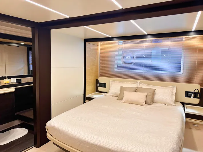 Tamara II Yacht Photos Pics Luxurious bedroom interior of 2018 Azimut 66 FLY yacht with modern design and cozy bedding.